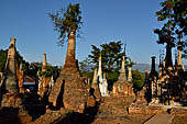 Inle Lake Myanmar. Indein, on the summit of a hill the  Shwe Inn Thein Paya a cluster of hundreds of ancient stupas. Many of them are ruined and overgrown with bushes. 